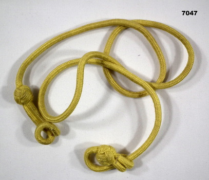 Yellow lanyard as part of a uniform.