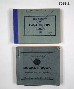 Two blue Financial books, a receipt book and a docket book.