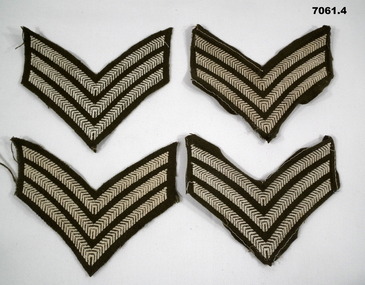 Four sets of Sergeant stripes for a tunic or great coat.