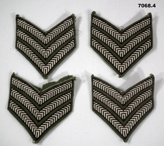 Four sets of Sergeant's stripes for a shirt.