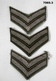 Three sets of Corporal stripes for a shirt.