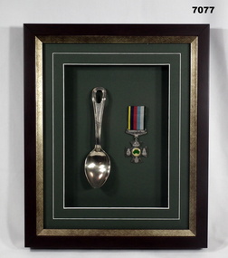 Framed medal and spoon re a WW2 POW.
