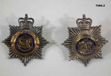Two RAASC bi-metal Army Officer's hat badges.