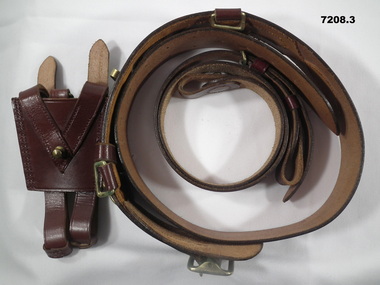 Brown leather Sam Browne belt with shoulder strap and sword frog.