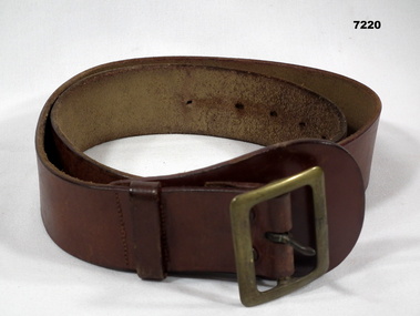 Leather belt with brass buckle.