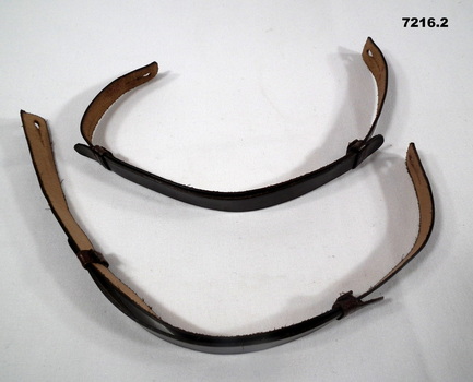 Brown leather strap for an Army peaked cap.