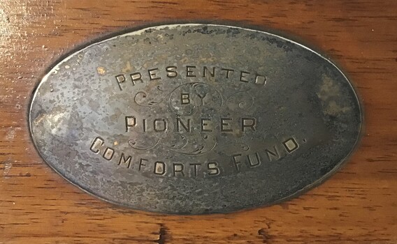 Plaque on the coat rack.