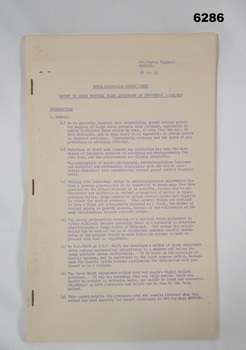 A paper report stapled in three places