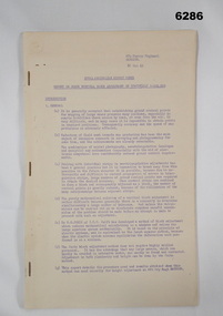A paper report stapled in three places