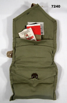 Unrolled Army issue khaki personal sewing kit.