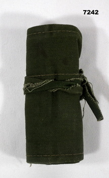 Jungle green coloured roll up sewing kit.