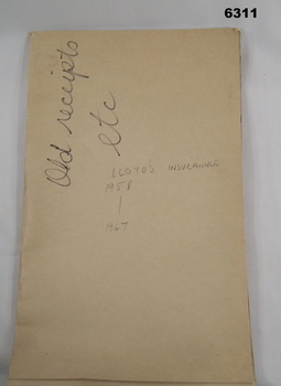 Soft covered folder containing numerous insurance documents