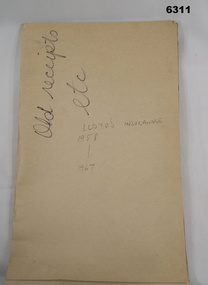 Soft covered folder containing numerous insurance documents