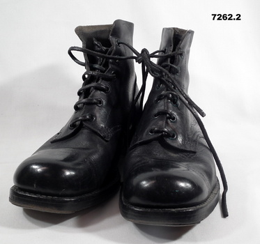 Pair of black leather ankle boots (AB).