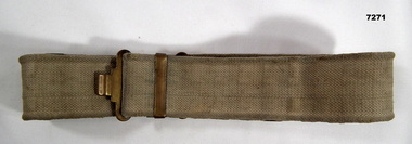 Canvas webbing belt with buckle.