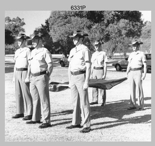 Contingent of Army Svy Regt personnel with the Australian flag on Australia Day, 1996. 