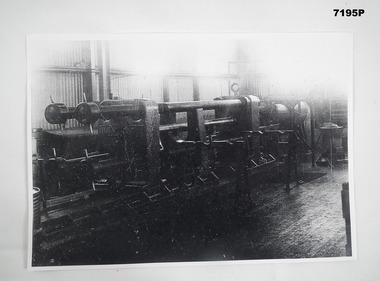 Black and white Photo copy of Arms Manufacturing Machine.