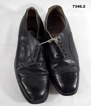 Pair of black leather shoes.