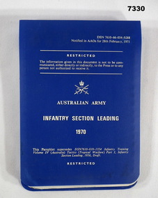 Blue plastic covered Army Infantry Training Manual.