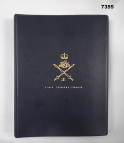 Blue covered two ring folder with Army Officer Training notes.
