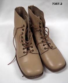 Pair of light brown leather replica boots.