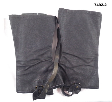 Pair of black stiffened canvas gaiters.