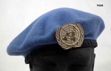 Light blue beret with United Nations badge,