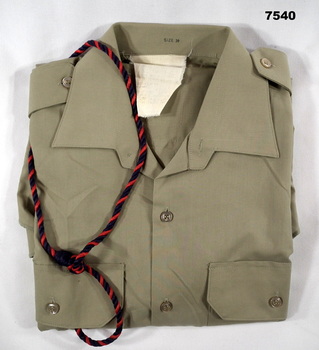 Short sleeved khaki polyester shirt with RACT lanyard.