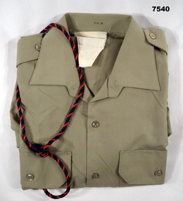 Short sleeved khaki polyester shirt with RACT lanyard.
