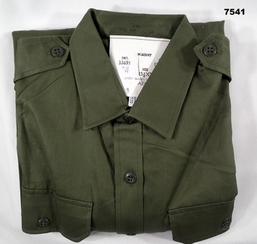 Jungle green coloured long sleeved cotton Army issue shirt.