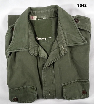 Jungle green coloured long sleeved cotton Army issue shirt.