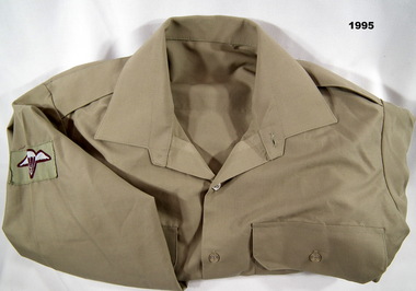Long sleeved khaki Army shirt.