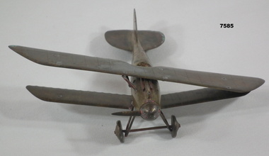 Trench art model of a bi-plane.