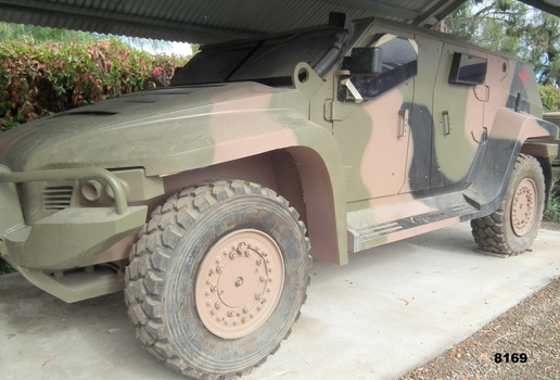 Side view of a Hawkei mobility vehicle.