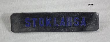 Stoklahsa metal uniform name tag.
