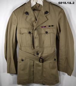 Khaki army summer uniform with peak cap.