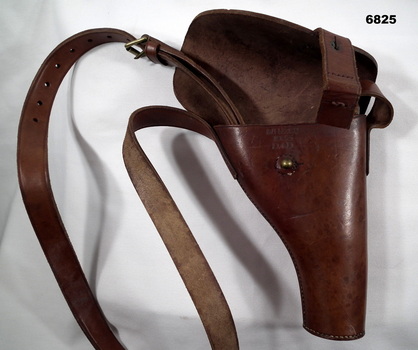 Leather pistol holder with strap.