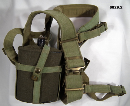 Webbing straps with water bottle.