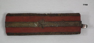 Imperial Japanese Rank Insignia = single star on red background.