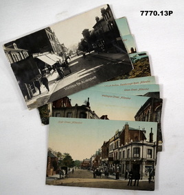 Thirteen coloured postcards depicting scenes from the town of Aldershot.