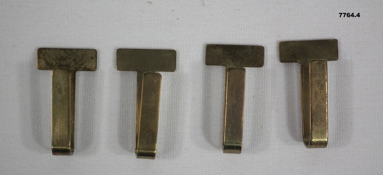Collection of four Army belt keepers.