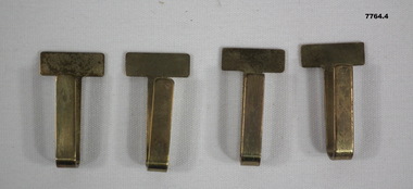 Collection of four Army belt keepers.