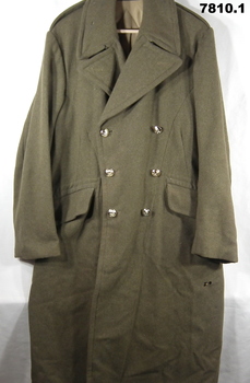 Army great coat and beret.