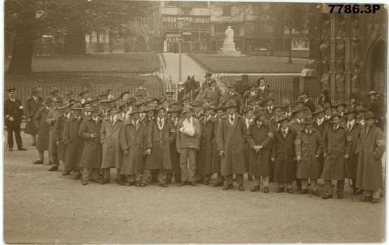 Group photograph of 57th Battalion medal recipients taken outside Exeter cathedral