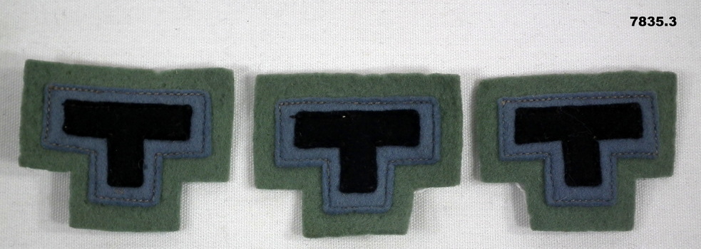 Three 2/23 Battalion colour patches.