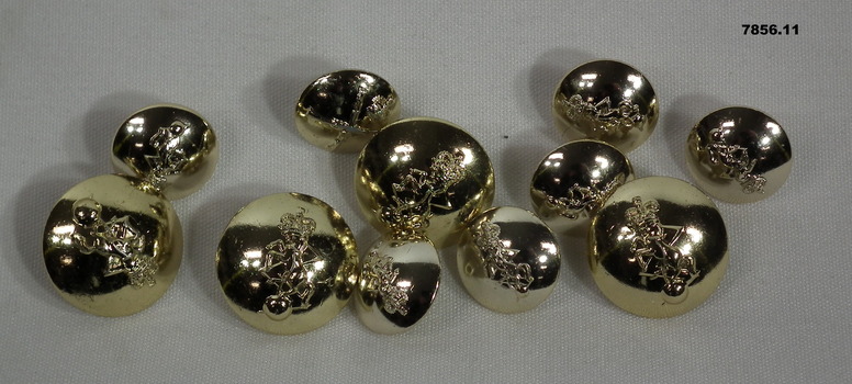 Collection of gold coloured buttons from RAEME uniform.