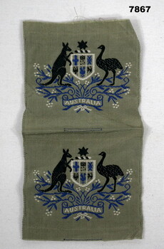 Conjoined W.O.1 badges featuring the Australian Coat of Arms.
