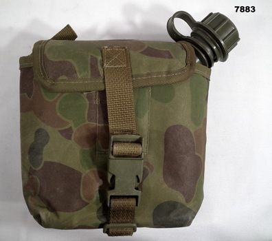 Field water bottle in carrier.