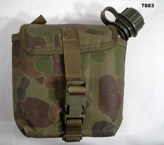 Field water bottle in carrier.