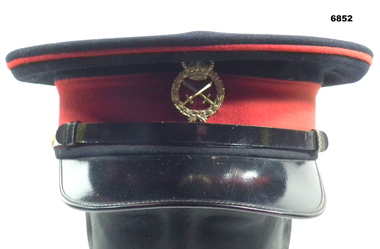 Formal Officer's peaked cap.